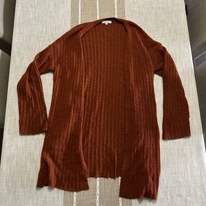 A long warm orange sweater